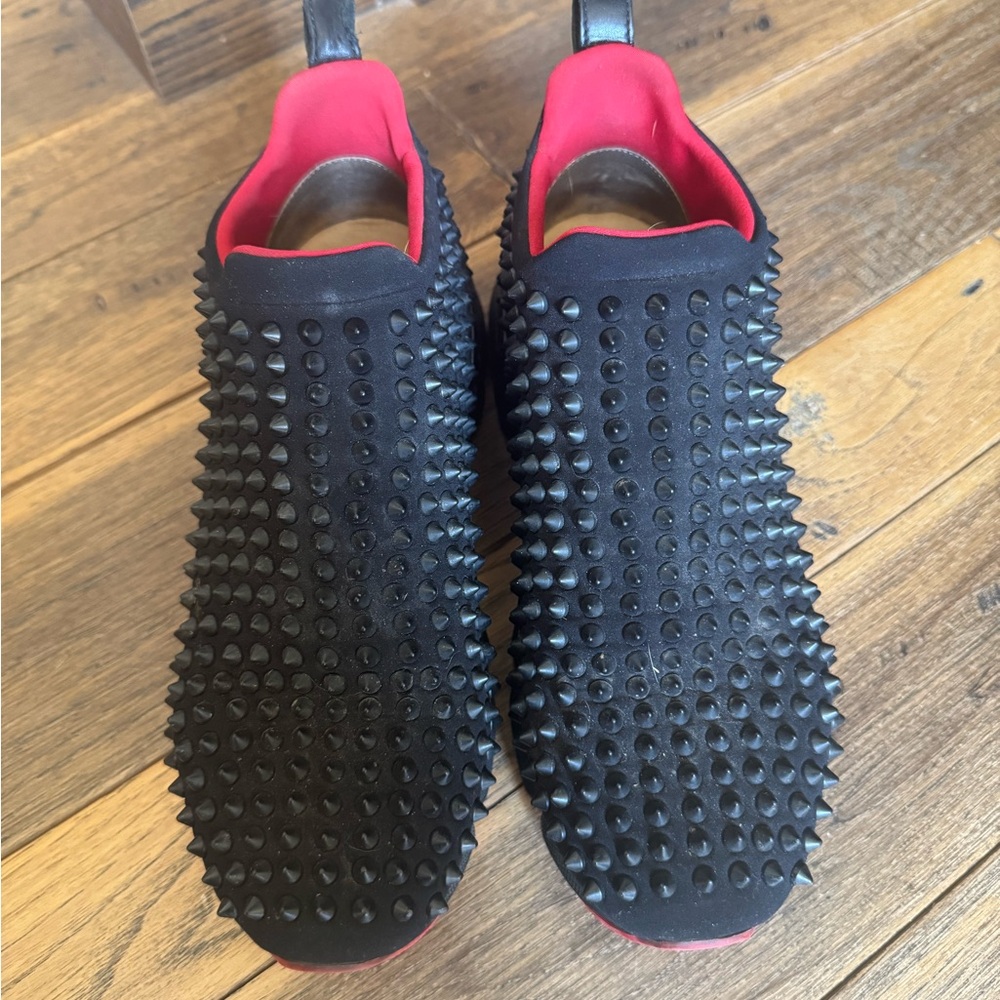 Christian Louboutin Black Studded Slip-On Sneakers with Red Lining